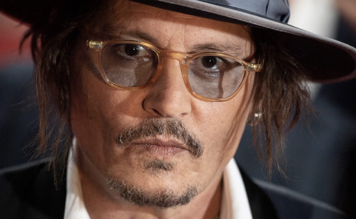 Close-up photo of Johnny Depp's face as he arrives at the Cannes Film Festival 2023.