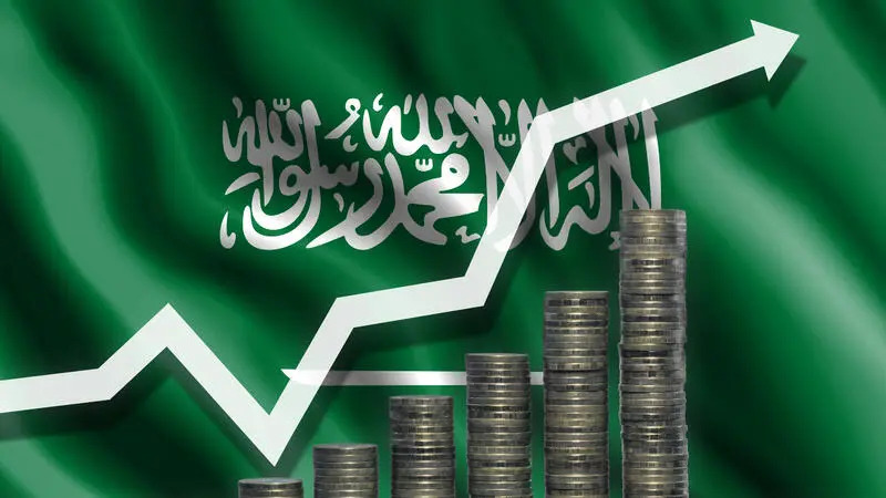 Up-arrow amidst coins and currencies symbolizing the growth of Saudi economy.