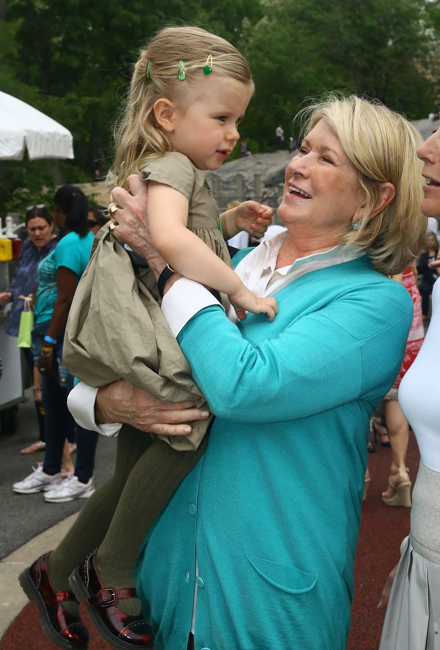 Martha Stewart lovingly carrying her granddaughter.